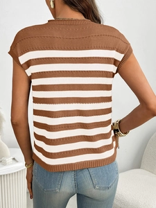 Detail of classic brown and white striped knit texture on women's crewneck short sleeve sweater