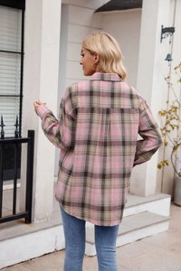 Detail view of pink and brown plaid oversized shirt jacket with back pleat design