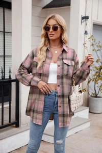 Close-up of pink and grey plaid shirt featuring chest pockets and thick woolen texture