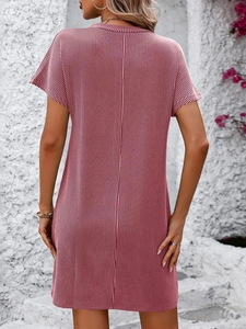 Back view of a pink and white striped short sleeve casual dress with pocket details
