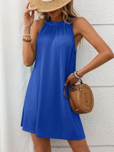 Detail of bright blue halter dress featuring vertical pleated texture and A-line cut