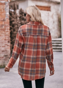 Rear view of an oversized plaid shirt showing red and blue flannel pattern and loose fit