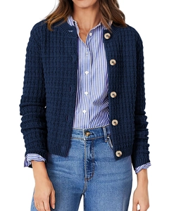 Detail of dark blue waffle knit cardigan with button closure and round neckline