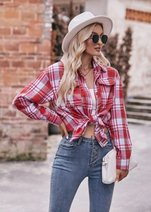 Detail of red and white plaid shirt with front knot design and casual fashion styling