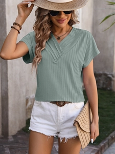 Detailed close-up of V-neckline and vertical ribbed texture on summer short sleeve top