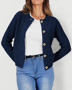 Detail of navy blue waffle knit cardigan featuring round neck and large buttons
