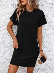 Close-up of black ribbed knit short sleeve dress with chest pocket and fine texture