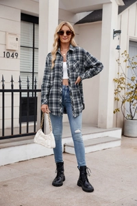 Outdoor street view of a casual oversized plaid shirt with pockets and lapel