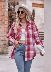 Close-up of oversize red and white plaid flannel shirt with classic collar and front pocket
