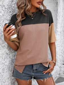 Detail of color-block waffle knit fabric with vertical stripes and side slit design