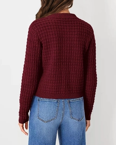 Back view of burgundy knit cardigan with textured square grid pattern and ribbed cuffs