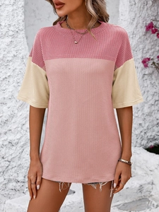 Detail of color-block ribbed knit short sleeve T-shirt showing texture and crew neck