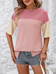 Detail of color-block striped knit top featuring burgundy and beige textured ribbed fabric
