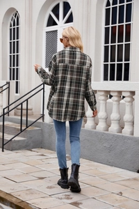 Back view of a loose-fit plaid shirt jacket with curved hem and brushed texture