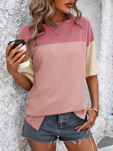Detail of color-block knit T-shirt featuring ribbed texture and side slit hem design