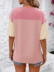 Close-up of color block striped fabric texture on the back of a women summer t-shirt