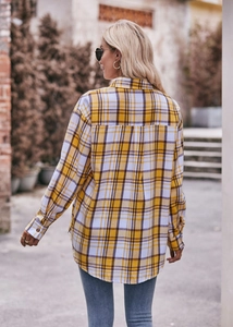 Rear view of oversize yellow plaid shirt with drop shoulders and casual loose silhouette