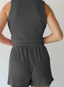 Back view of a dark gray ribbed knit two-piece set featuring a tank top and shorts