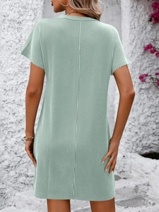 Detail view of the mint green vertical striped texture on a summer mini dress back