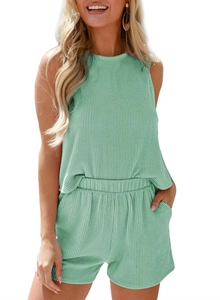 Detail of mint green ribbed knit texture on sleeveless top and elastic waist shorts