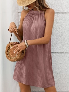 Detailed macro view of the pleated fabric texture on the mauve halter sleeveless dress