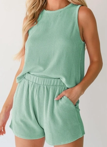Detail of mint green ribbed fabric on sleeveless top and high-waist shorts set