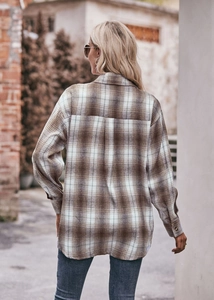 Detail of the oversized flannel plaid shirt back with pleat and drop shoulder design