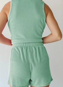 Detail of mint green ribbed knit sleeveless top and shorts set from a back view perspective