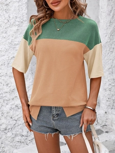 Detail of color-block knit T-shirt with vertical rib texture in green, orange and white