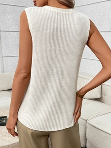 Detailed back view of white knit sleeveless top with textured vertical patterns and curved hem