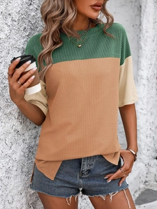 Detail of color-block knit T-shirt with vertical ribbed texture and crew neck style