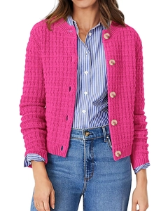 Close-up of vibrant rose pink knit cardigan with elegant large gold buttons and round neck
