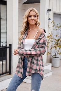 Detail of pink plaid flannel shirt with amber buttons and soft brushed texture