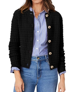 Detail of waffle knit texture and marble buttons on a black women's cardigan