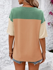 Close-up of three-color vertical ribbed texture on a casual crew neck short sleeve tee