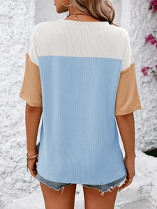 Detail of color-block ribbed knit short sleeve T-shirt showing back view and texture