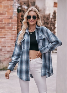 Close-up of blue and white oversized flannel plaid shirt with chest pockets