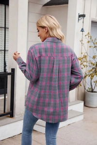 Detail of pink and blue plaid flannel shirt with drop shoulders and back pleat design