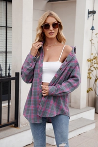 Close-up of pink and grey flannel plaid shirt with soft texture and button details