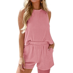 Pink ribbed knit two-piece set featuring sleeveless slim tank top and drawstring shorts