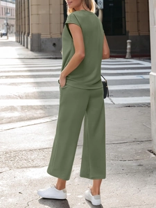 Detail view of women's olive green two-piece lounge set with short sleeve top and wide leg pants