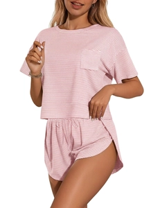 Detail of pink and white striped pajama set fabric with short sleeves and pocket