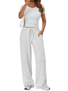 Detail of grey knit fabric on short sleeve crewneck top and drawstring wide leg trousers