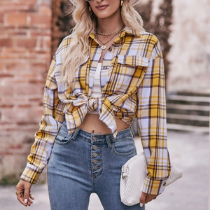Women's oversize yellow plaid flannel shirt with front pockets and long sleeves