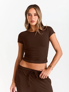 Detail view of dark brown ribbed knit two-piece lounge set with short sleeve top and joggers