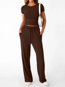 Deep brown two-piece set featuring short sleeve crop top and wide-leg drawstring trousers
