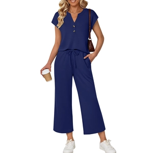 Women's dark blue two-piece set featuring V-neck short sleeve top and drawstring trousers