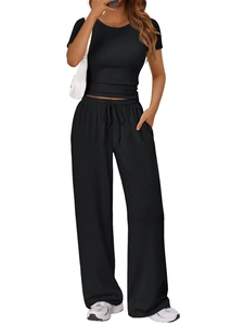 Detail of high-waist drawstring trousers and black short sleeve t-shirt lounge set