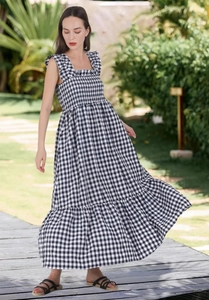 Detail of smocked bodice and square neckline on black and white gingham dress