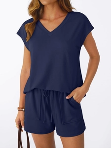 Detail of dark blue V-neck short sleeve top and matching drawstring shorts set